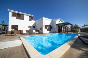Sensational Playa Blanca Villa | 3 Bedrooms | Villa Myoga | Spacious Sun Terrace | Outdoor Pool and BBQ | Montana Roja